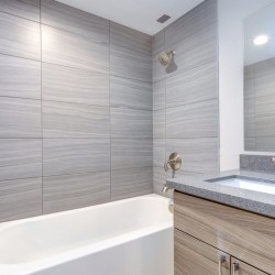 Interior of grey modern bathroom after remodeling.